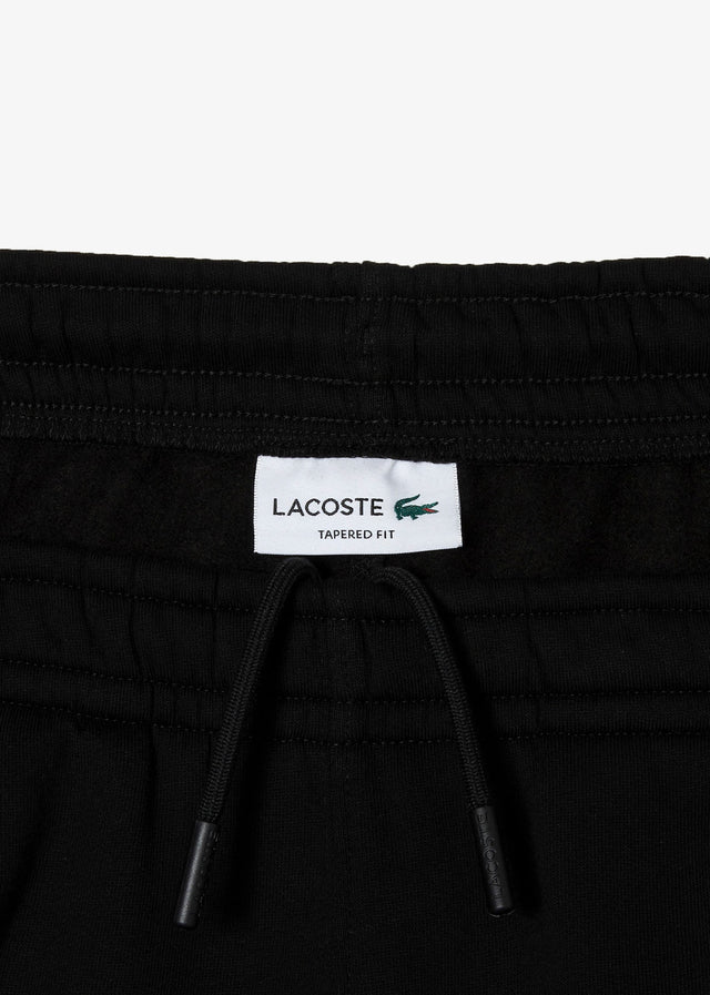 Lacoste Hosen  Contrast stripe tracksuit trousers - black 